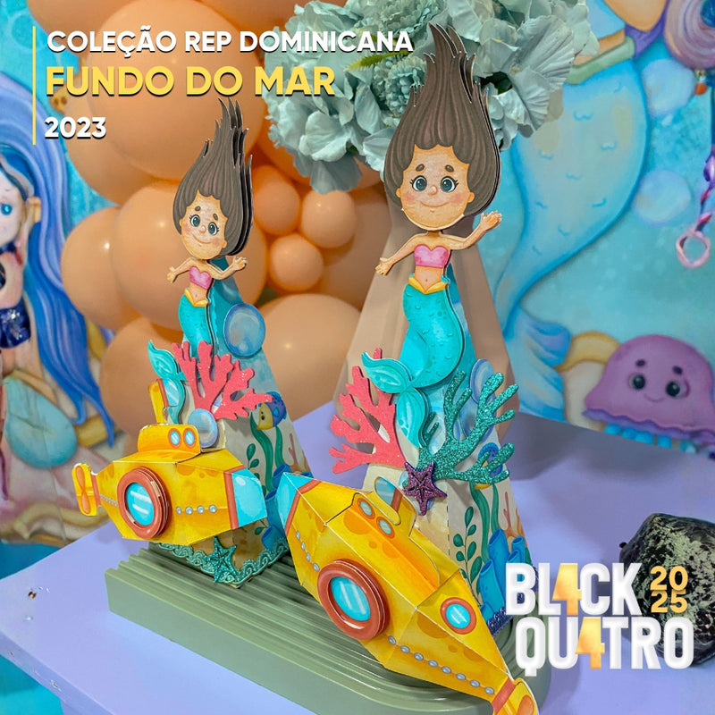 Detalhe frontal da Coleção Fundo do Mar mostrando recortes precisos, conchas e acabamento artesanal