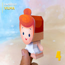 Vista lateral do Papertoy Wilma Flintstone mostrando os detalhes do vestido branco e acabamento artesanal